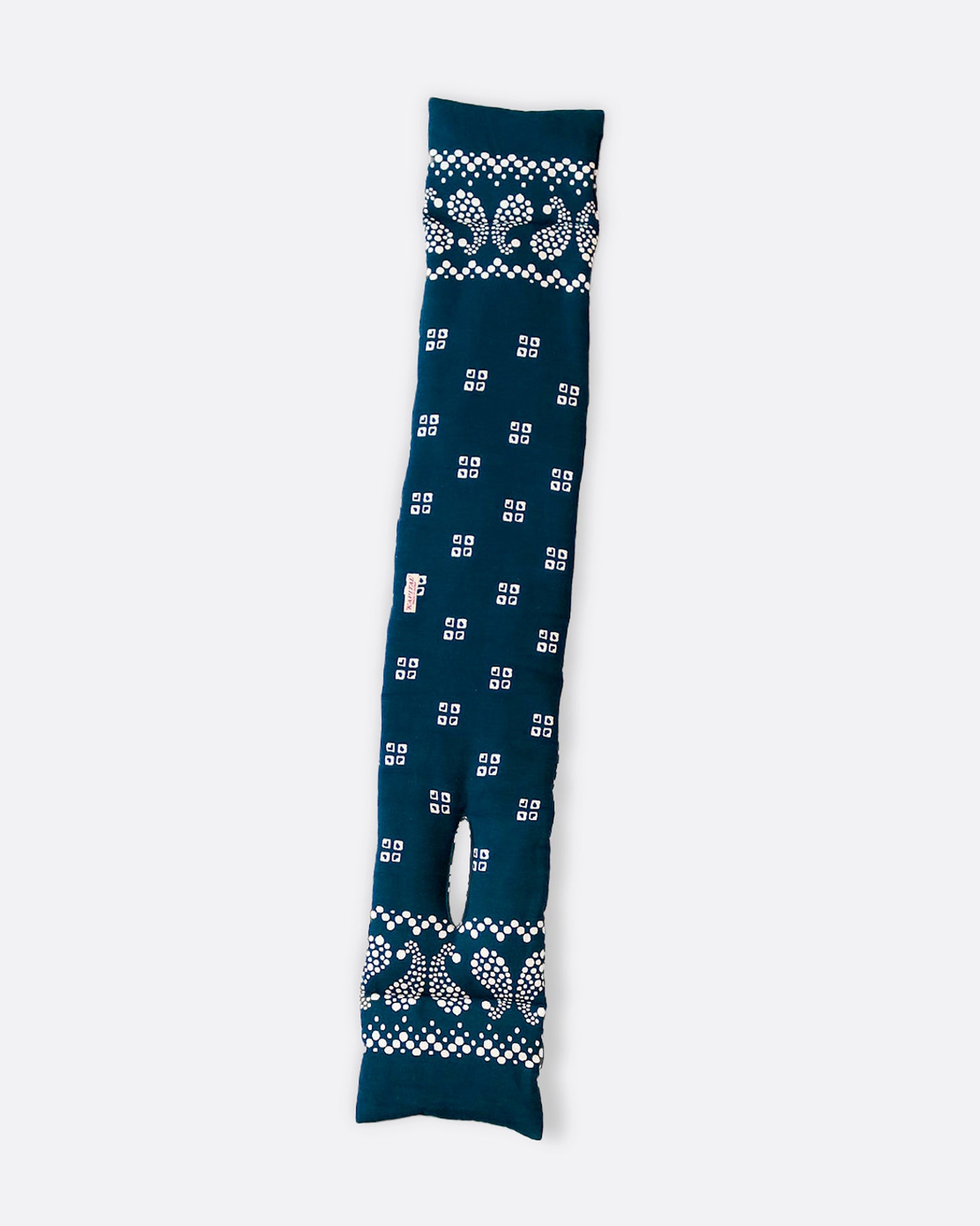 An insulated blue and white paisley printed bandana scarf with an opening at one end, shown open lying flat.