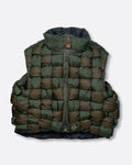 A green nylon padded vest woven in a traditional basket weave design. It has a reversible grey interior, a front zip closure, curved hemline, and internal snap welt hand pockets. Shown from the front.