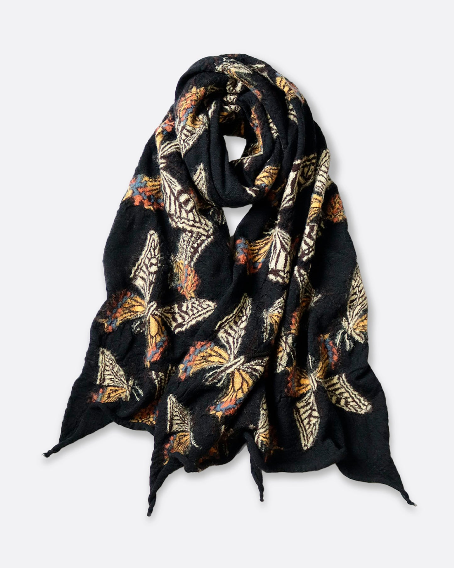 A black compressed wool scarf with butterflies all over it, shown looped.
