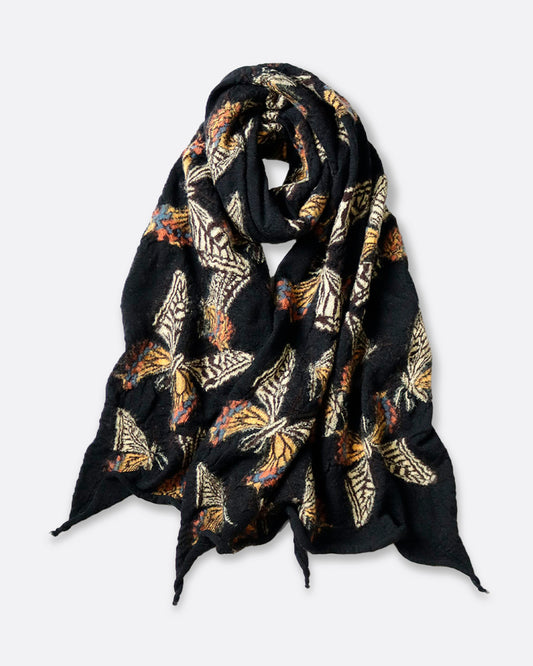 A black compressed wool scarf with butterflies all over it, shown looped.