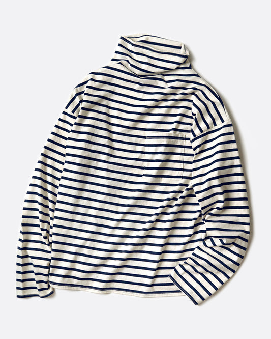 A white mock neck long sleeve shirt with navy horizontal stripes and a front pocket. Shown from the front.