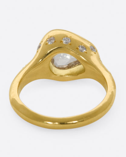 Yellow gold trillion diamond ring, back view showing the diamond through the gallery and star-set diamonds