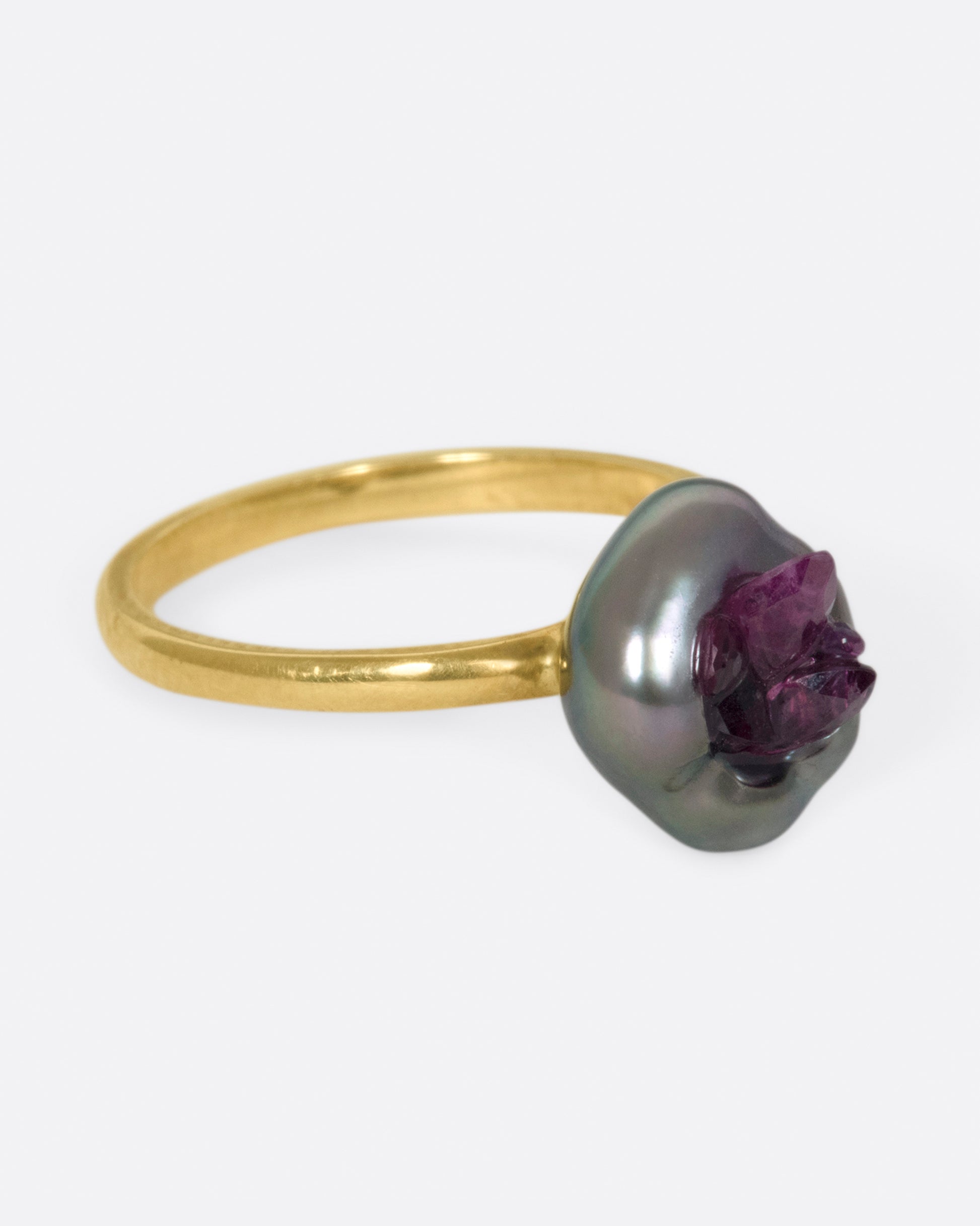 Yellow gold freshwater pearl ring lined with reclaimed rubies. View from the alternate side.
