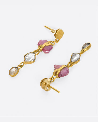 Yellow gold ruby and Herkimer diamond drop earrings, the pair laid flat