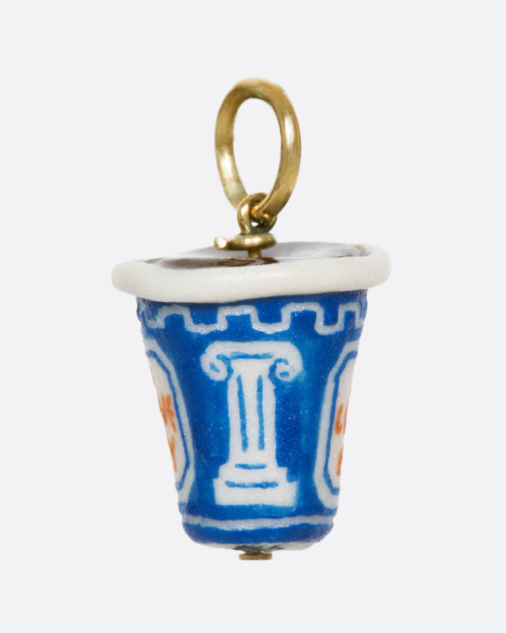 You can't get more NYC than this iconic to-go coffee cup. Look closely at this handmade and painted porcelain charm, and you'll find "I love NY" skillfully painted in tiny letters
