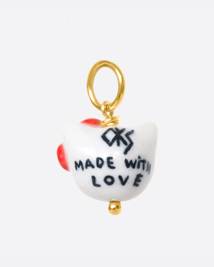 Porcelain cat face charm with red bow, back with Made with Love painted in black