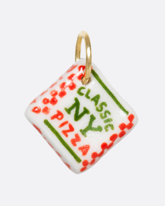 A white porcelain Classic New York pizza box charm with a yellow gold bail