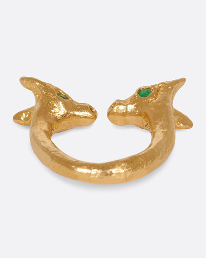 Yellow gold animal head ring with emerald eyes, back view of the band below the two facing heads