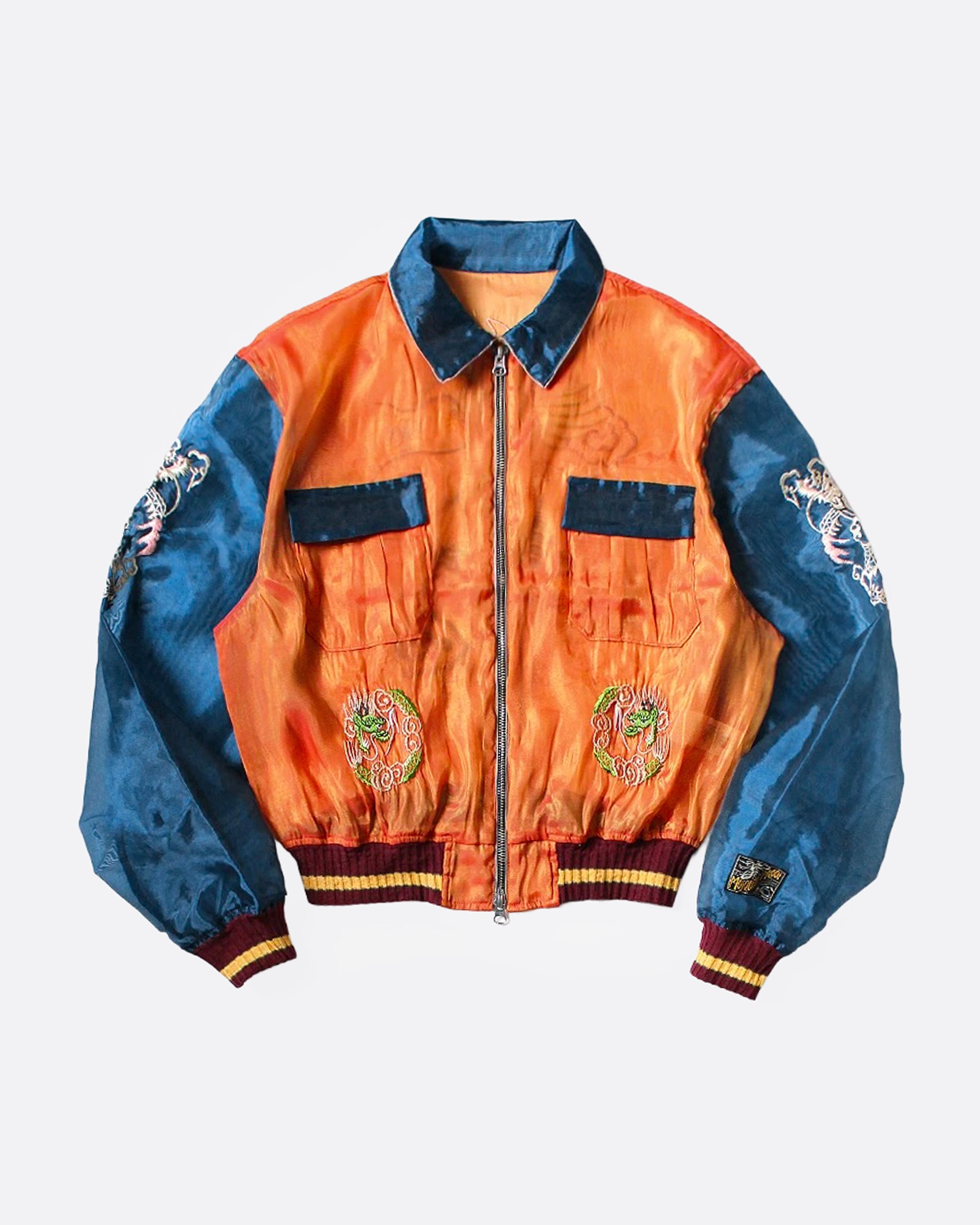 An orange and blue sheer bomber jacket with dragon embroidery, shown from the front.