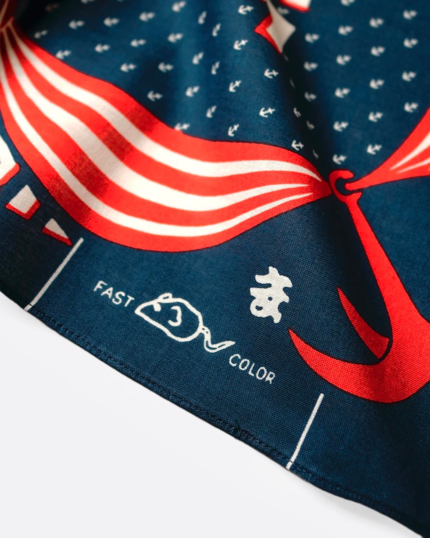 A close up of a navy, red, and white bandana.