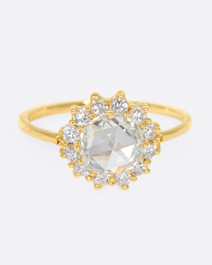 Yellow gold diamond halo ring, front view of the rose-cut center and diamond halo
