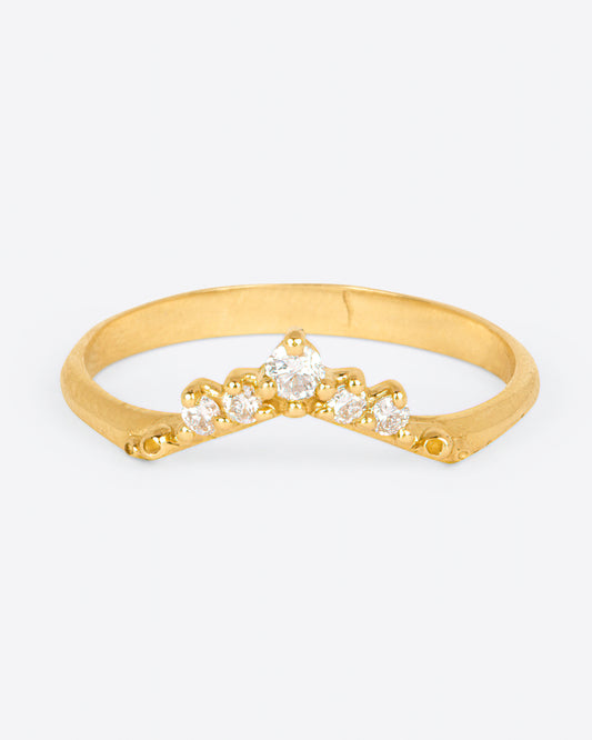 A yellow gold ring with an arched front and five diamonds. Shown from the front.