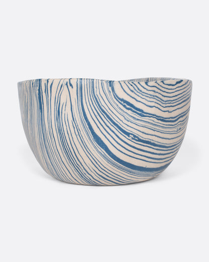 Blue and cream marbled ceramic bowl, angled view