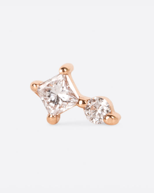 A yellow gold stud earring with a princess cut diamond stacked on top of a round diamond. Shown from the front.