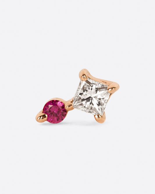 A yellow gold stud earring with a princess cut diamond and a round pink sapphire. View from the front.