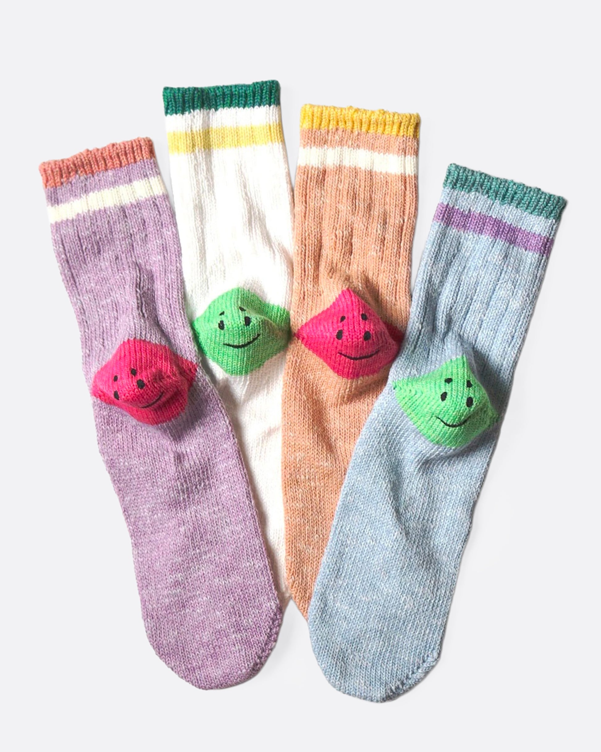 Four colorful socks with smiley faces on each heel shown from the back.