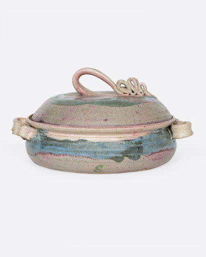 Vintage ceramic casserole dish with lid, glazed in purple, pink and green with sculpted twisted handles