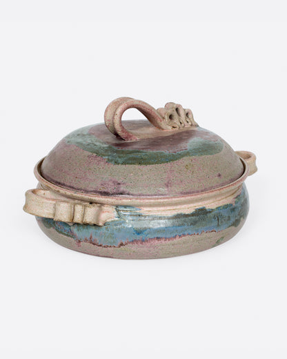 Vintage purple and green ceramic casserole dish, angled view of the lid knot