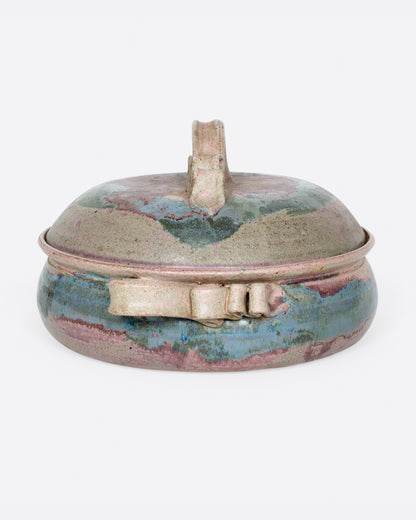 Vintage purple and green ceramic casserole dish, side view showing a handle