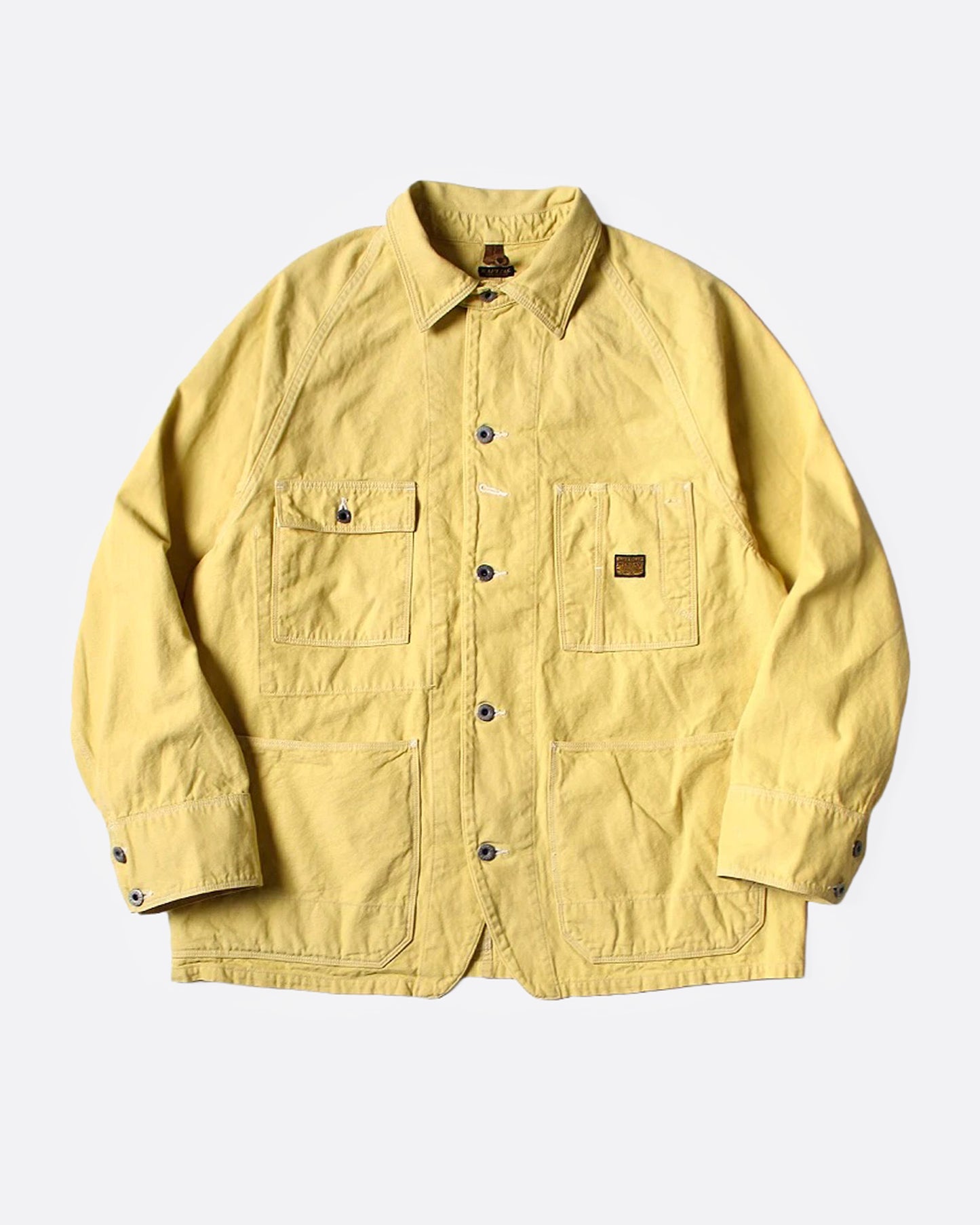 A yellow canvas chore coat, shown from the front.