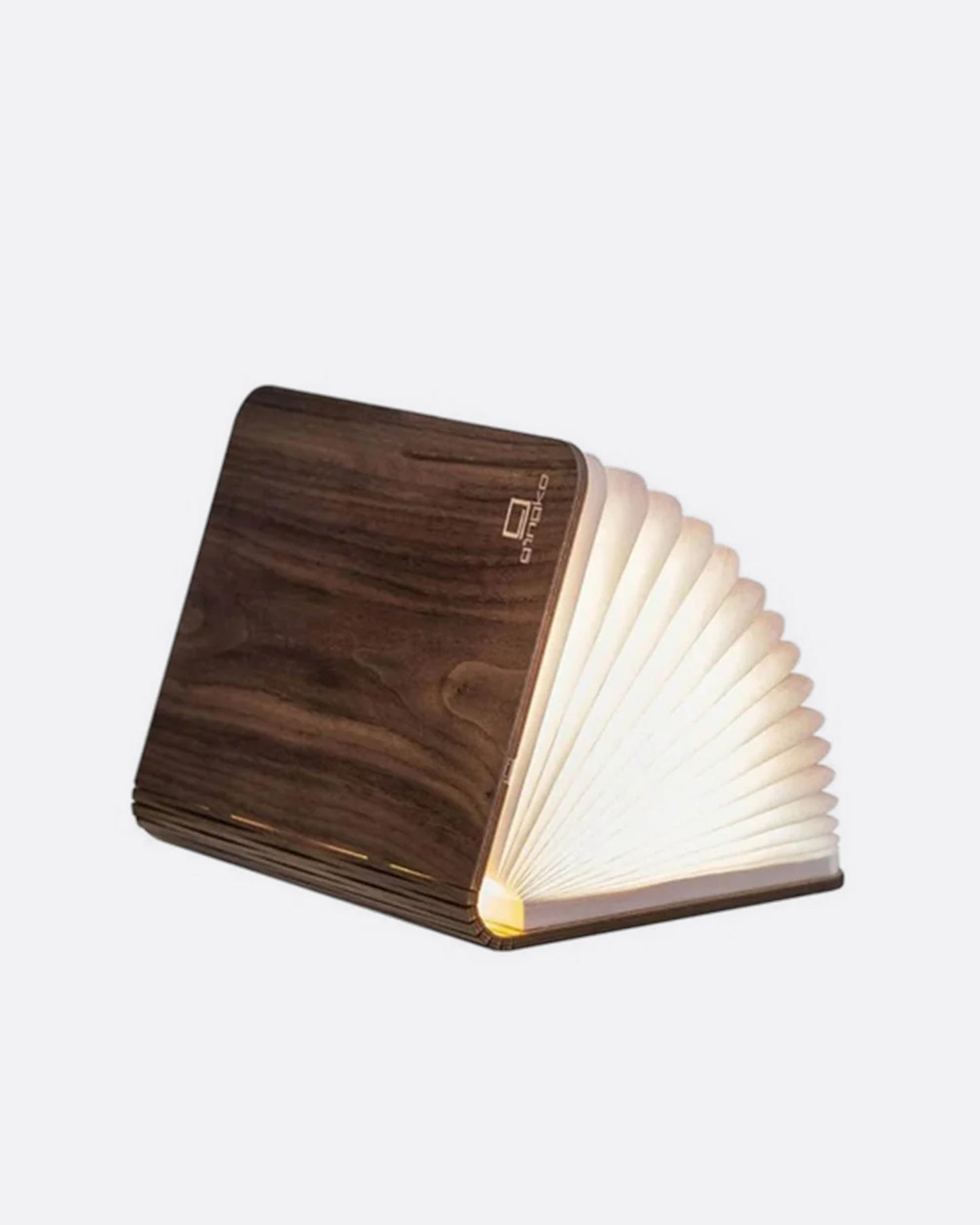 A book shaped light with a laser-cut wooden cover, shown open from the side.
