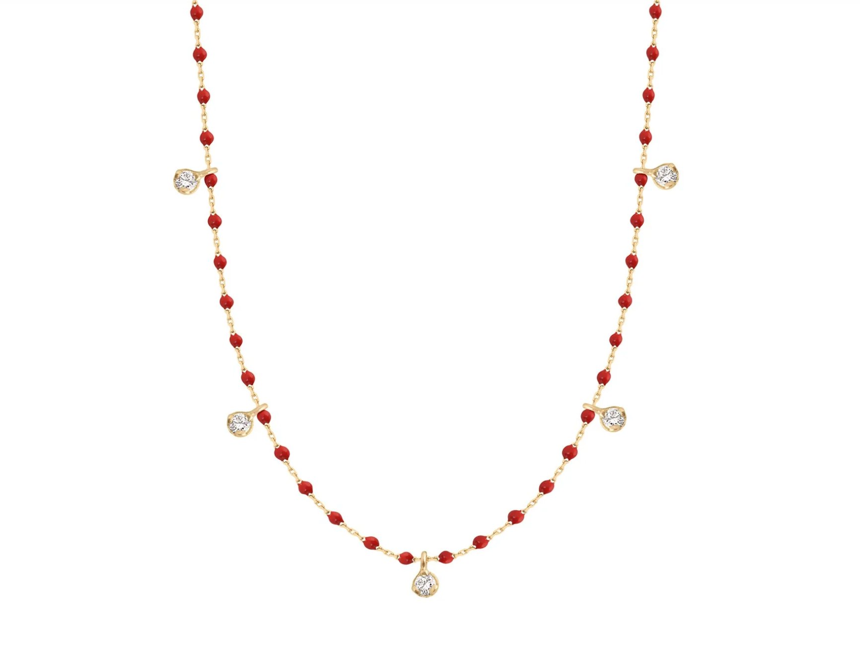 A yellow gold cable chain necklace with droplets of red resin and five diamond charms. Shown from the front.