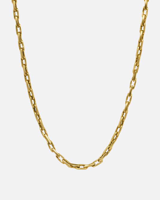 A yellow gold box chain with elongated links, shown from the front.