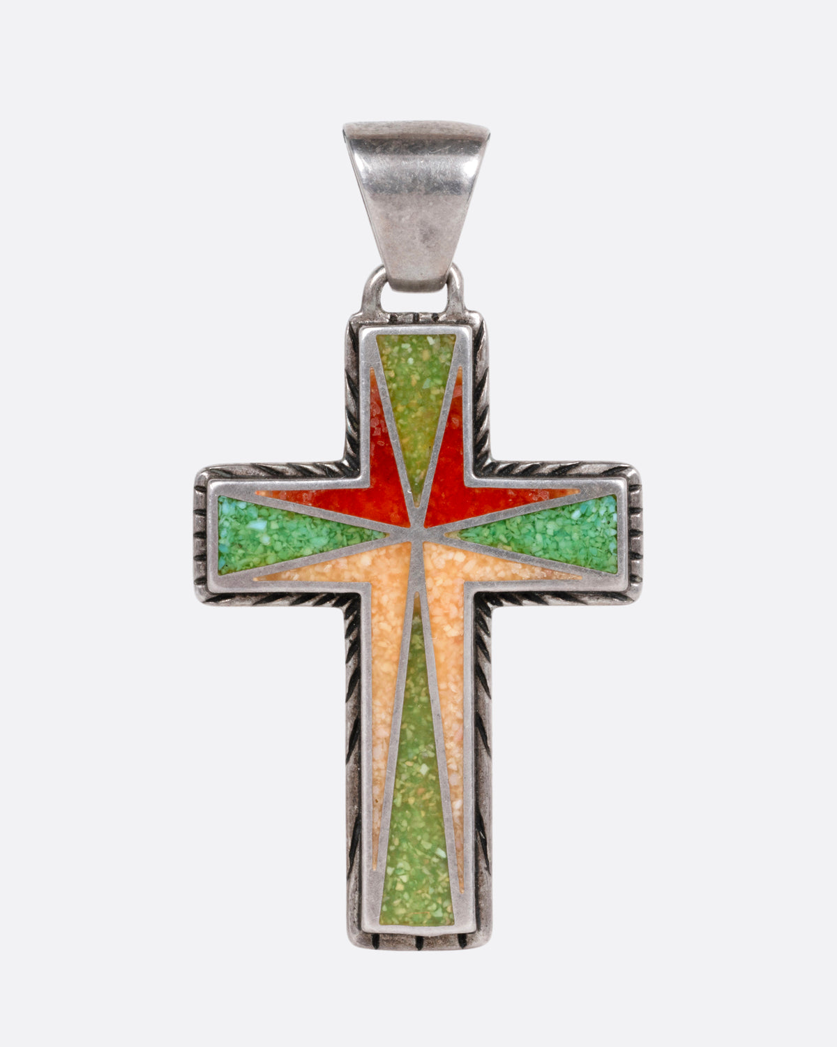 A silver cross with colorful inlay, shown from the front.