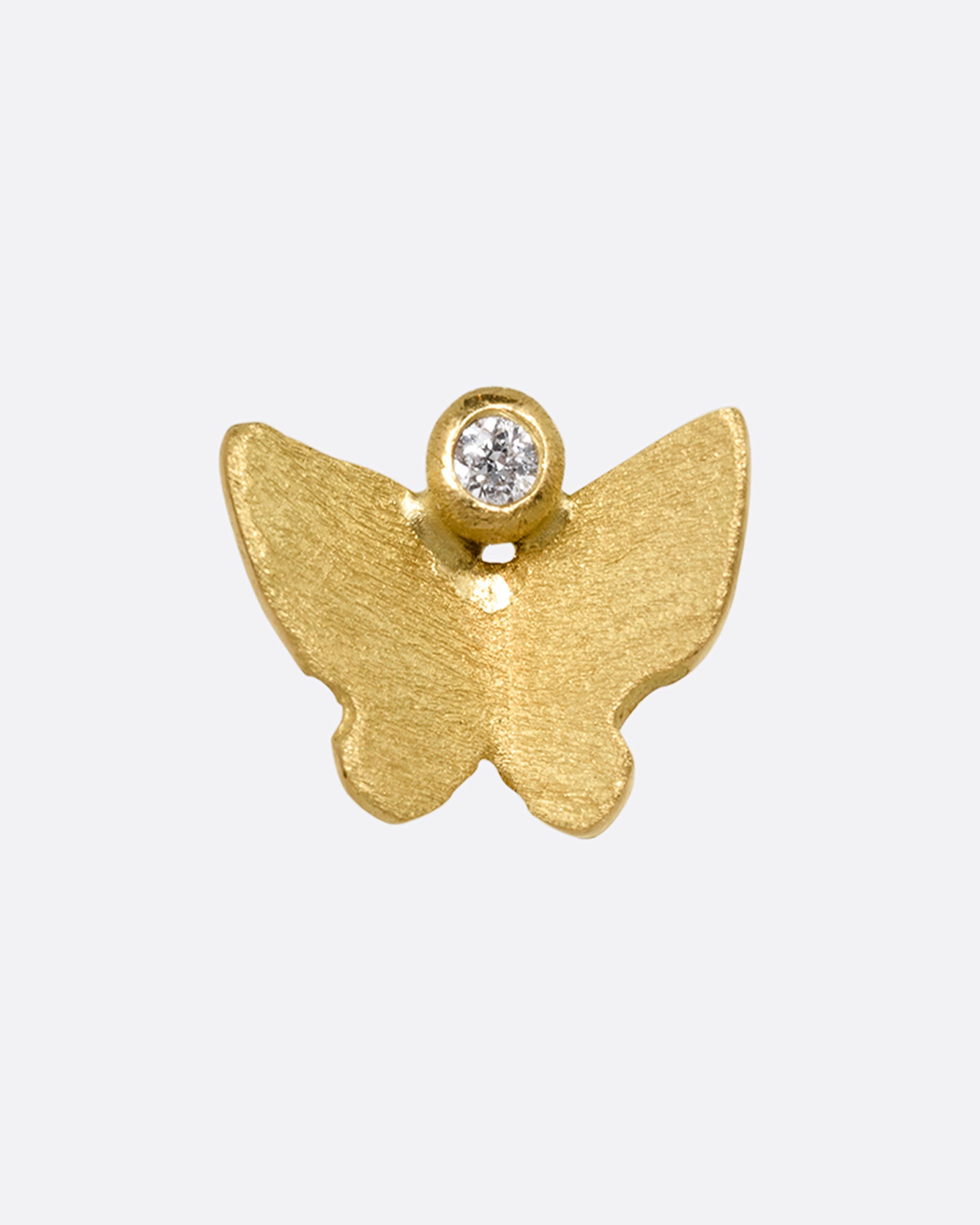 A yellow gold butterfly earring with a single diamond. Shown from the front.