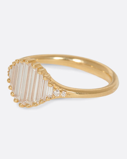 A signet ring with a face made entirely of baguette diamonds. Shown from the side.