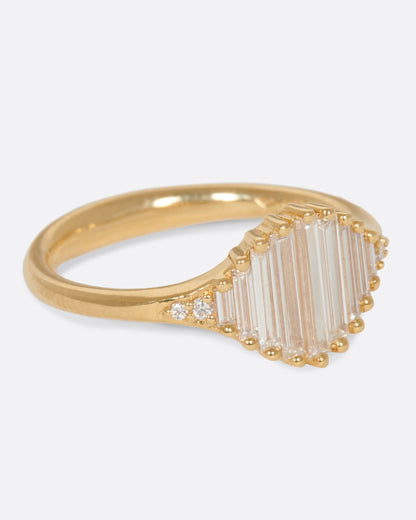 A signet ring with a face made entirely of baguette diamonds. Shown from the side.