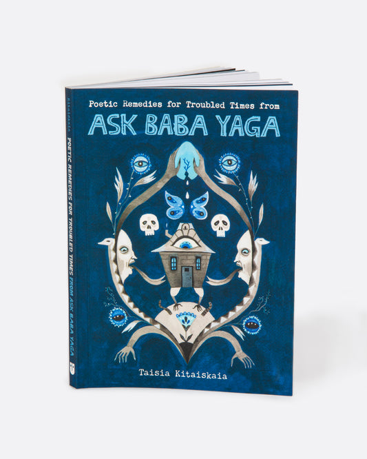 The book 'Ask Baba Yaga' by Taisia Kitaiskaia with a blue cover and Baby Yaga imagery. Shown standing up from the front.