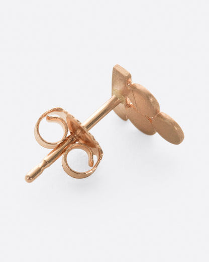 Rose gold stacked circles stud earring, side view showing the post and back