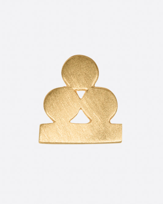 A yellow gold earring with three matte circles sitting on a bar. Shown from the front.