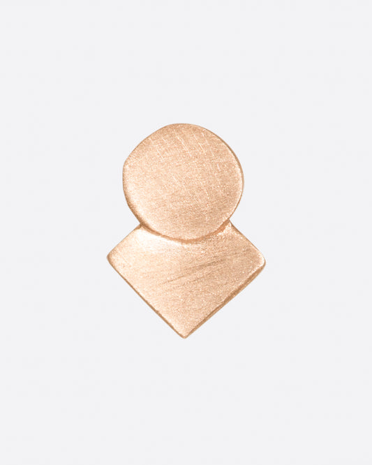 A rose gold square stud earring with overlapping circle and matte finish. Shown from the front.
