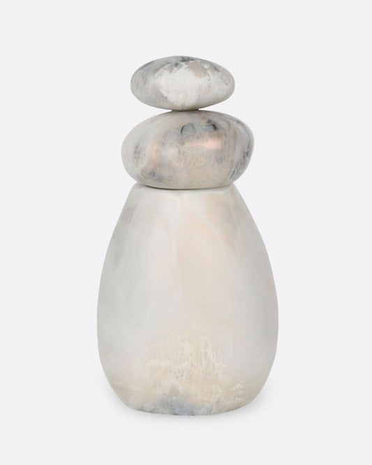 A pepper grinder with stacked resin stones. Shown from the front.
