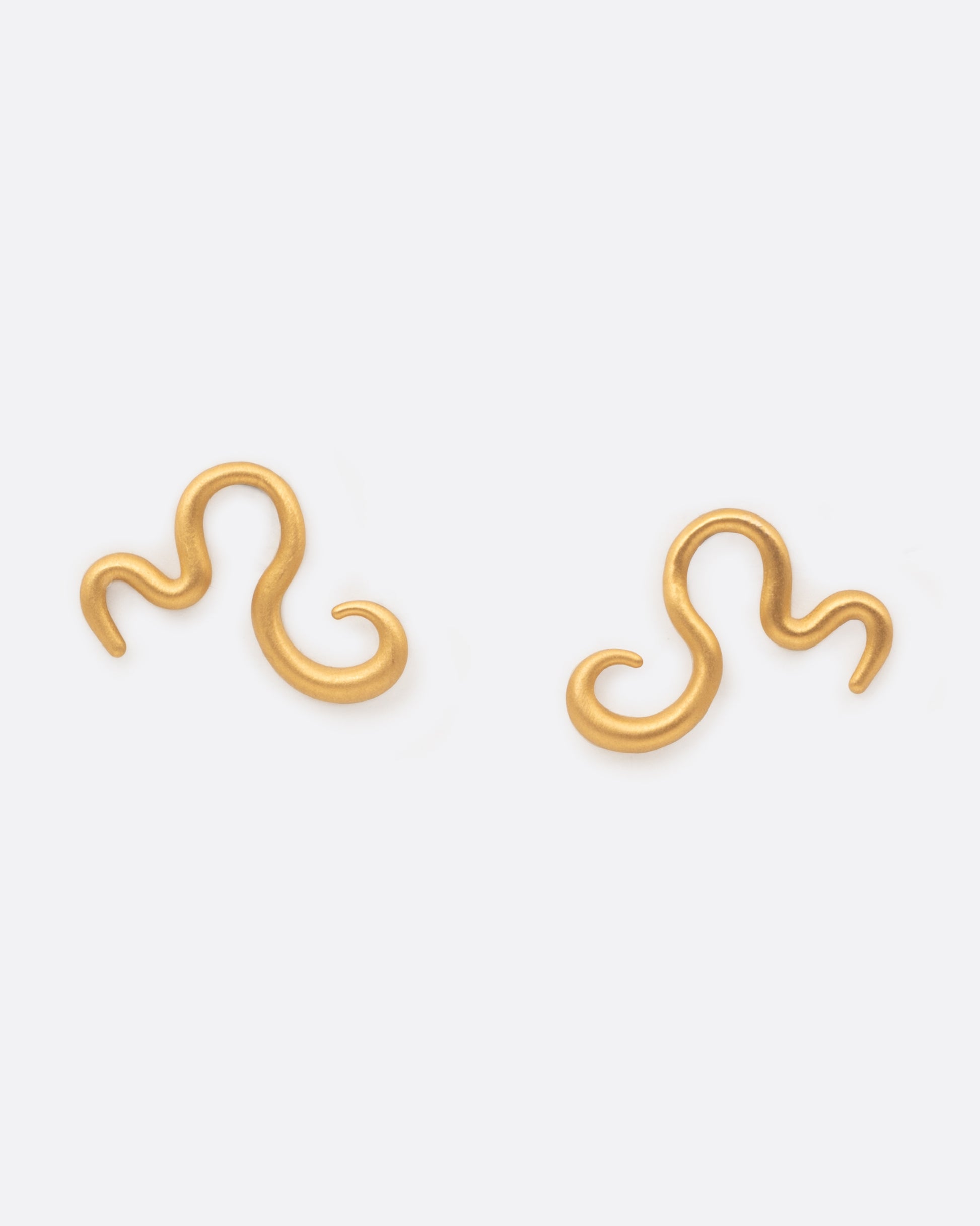A pair of curved 22k yellow gold snake stud earring. Shown from the front.