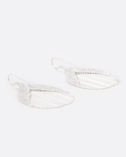 Silver strand teardrop earrings, side view laid flat
