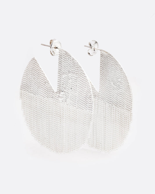 two large sterling silver earrings are hanging on a 45 degree angle. they are in a shape of a seven eighths of a circle, like one pie piece missing. The bottom half is made of chain and moves freely. There are posts and butterfly backings in the open piece of the circle.