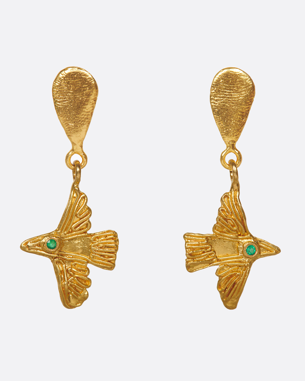 Oraik bird earrings in yellow gold, textured gold birds with emerald eyes hanging from teardrop studs