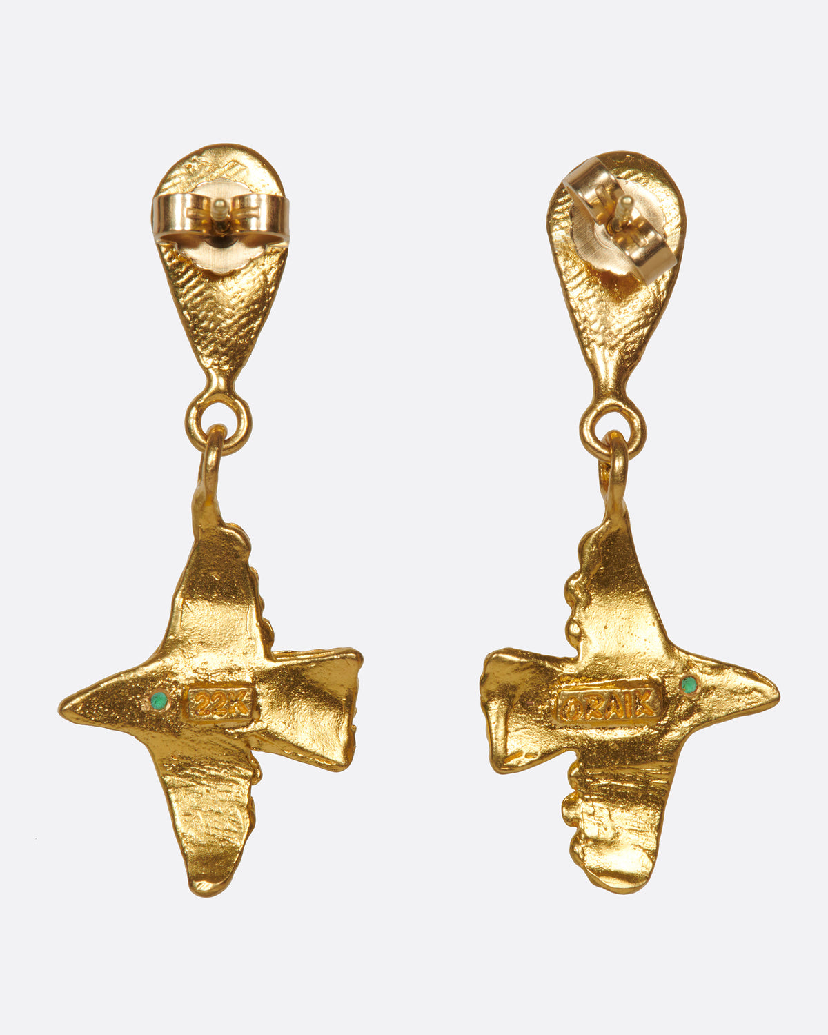 Yellow gold bird earrings with emerald eyes, back of the bird earrings showing the butterfly backs