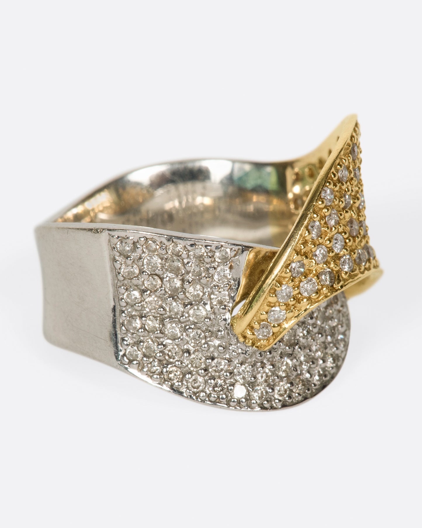 A half white gold, half yellow gold, diamond-covered ring to wrap around your finger.