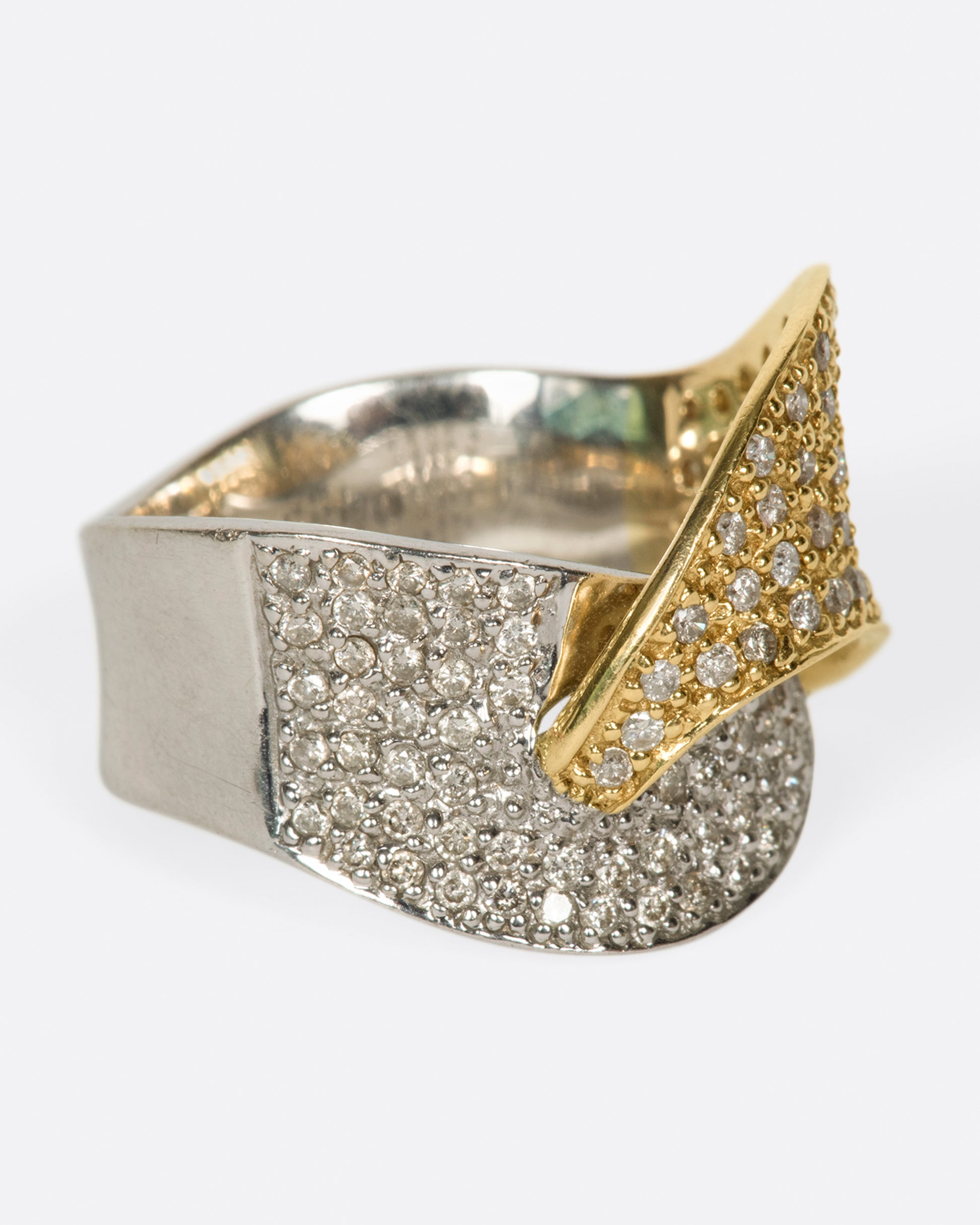 A half white gold, half yellow gold, diamond-covered ring to wrap around your finger.