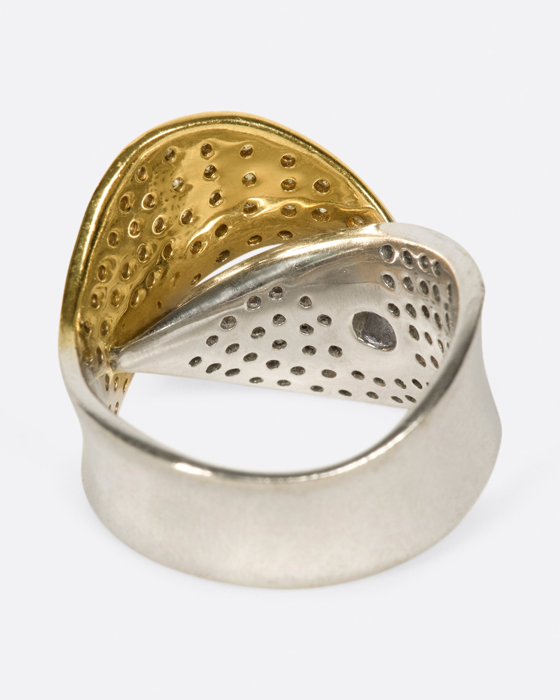 A half white gold, half yellow gold, diamond-covered ring to wrap around your finger.