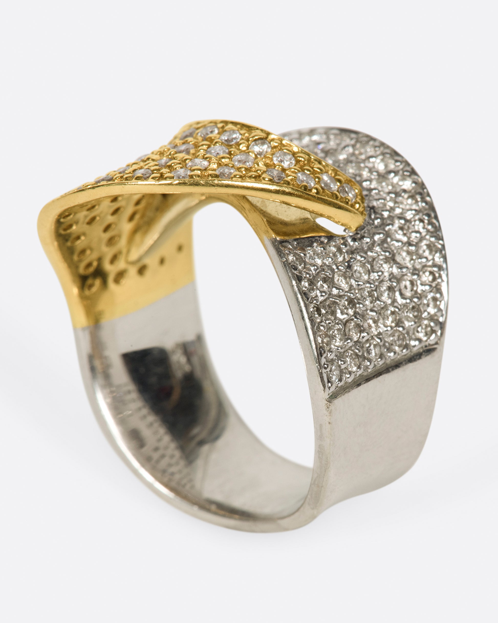 A half white gold, half yellow gold, diamond-covered ring to wrap around your finger.