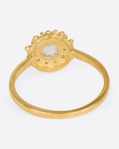 Yellow gold diamond halo ring, back view of the band and the gallery under the diamond