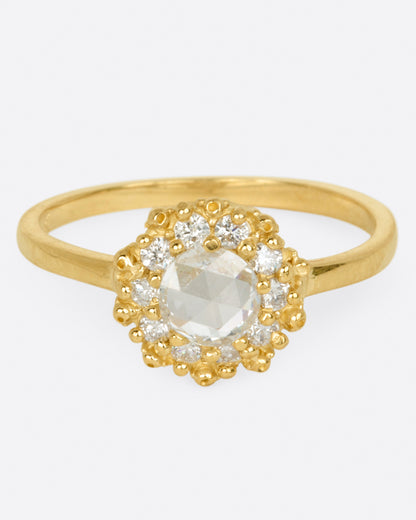Ruta Reifen Sunshine ring in yellow gold, a rose-cut diamond surrounded by a halo of round diamonds and gold beads on a thin band