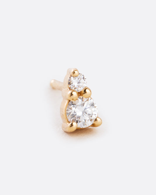 A yellow gold earring with two diamonds stacked. Shown from the front at an angle.