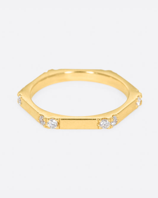 A hefty, hexagonal ring with diamond on each corner.