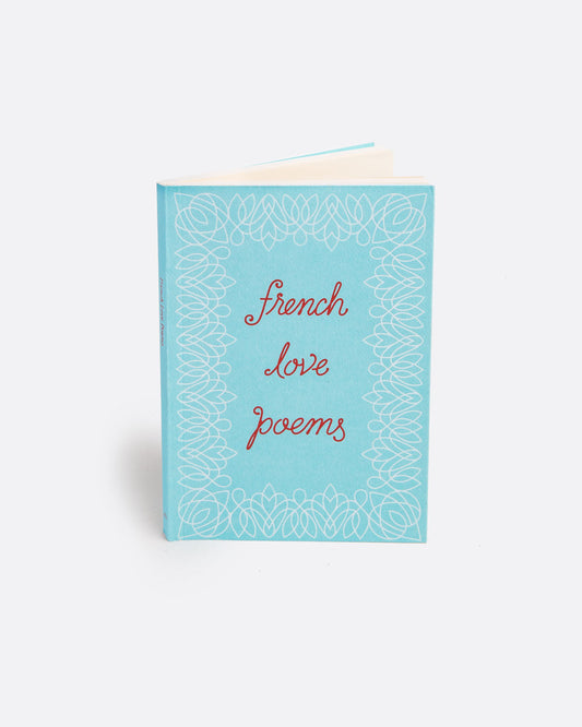 A light blue paperback book with 'French love poems' in red script on the cover. Shown standing up from the front.